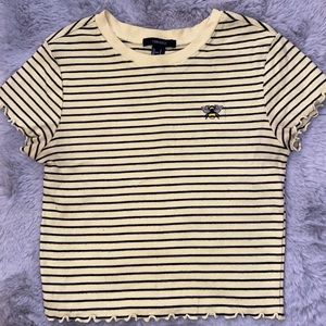 Yellow + black striped cropped shirt with a bee.